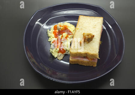 Ham and tomato sandwich with scrambled egg Stock Photo