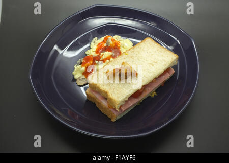 Ham and tomato sandwich with scrambled egg Stock Photo