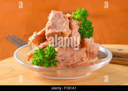 chunks of canned tuna in glass bowl Stock Photo