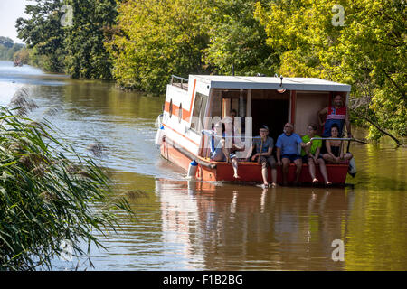 Boat with people on The Bata Canal near port Veseli Nad Moravou, South Moravia, Czech Republic Stock Photo