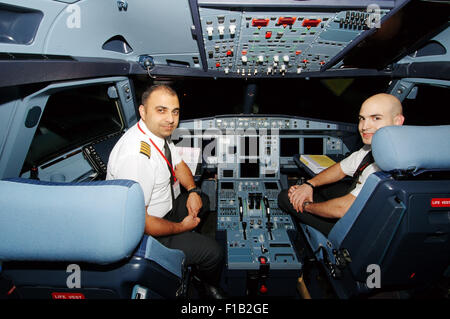 Oct. 15, 2014 - Sharjah emirate, United Arab Emirates - Pilots aircraft Airbus A-320 in the cockpit, airport Sharjah, Sharjah (emirate), UAE (Credit Image: © Andrey Nekrasov/ZUMA Wire/ZUMAPRESS.com) Stock Photo