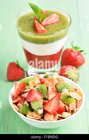 Healthy Layered Dessert With Muesli And Strawberries On Table Stock 