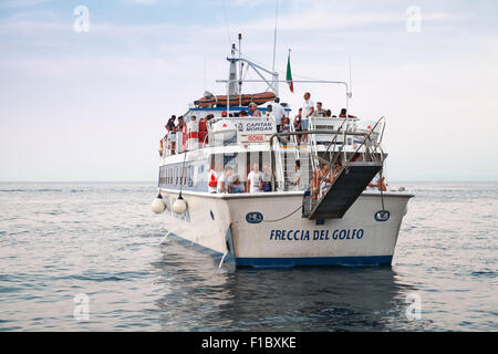 Lacco Ameno, Italy - August 14, 2015: Departure of white touristic ship for sea trips operated by Captain Morgan, Ischia Stock Photo