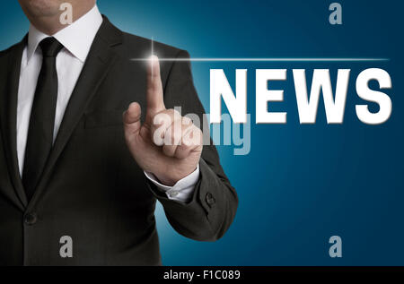 news touchscreen is operated by businessman concept. Stock Photo