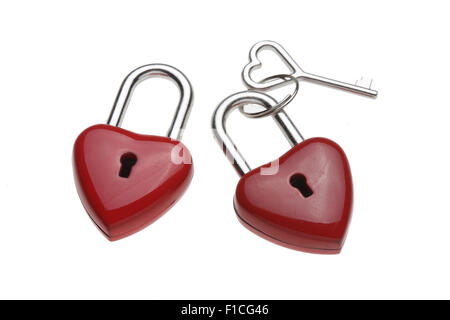 Tiny heart-shaped lock, padlock, as love lock with keys with heart-shaped handle Stock Photo