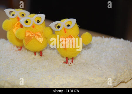 Easter cake decorated with little chicks and coconut flakes Stock Photo