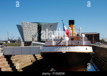 SS Nomadic, the last remaining ship of the White Star Line, in dry dock at Titanic Belfast Centre, Northern Ireland Stock Photo