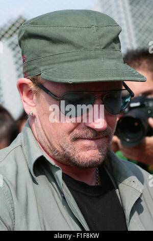 Turin, Italy. 01st Sep, 2015. Bono Vox, the frontman of the Irish rock band U2 arrives at the Olympic Stadium where hundreds of their fans wait for press conference and autograph signing. Credit:  Elena Aquila/Pacific Press/Alamy Live News Stock Photo