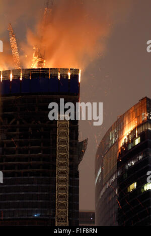 Fire on upper two floors of unfinished Federation Tower in Mocsow City business district 2012.04.02. Stock Photo
