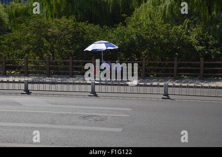 Beijing, Beijing, CHN, China. 28th Aug, 2015. Beijing, CHINA - August 31 2015: (EDITORIAL USE ONLY. CHINA OUT) With parade in memory of victory of 70th anniversary of the War of Resistance Against Japan coming, anti-terrorism in Beijing goes to the highest level. 850000 volunteers with red armband go to streets to monitor if there's any unsafe factor. © SIPA Asia/ZUMA Wire/Alamy Live News Stock Photo