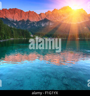 Fantastic sundown on mountain lake Eibsee, located in the Bavaria, Germany. Dramatic unusual scene. Alps, Europe. Stock Photo