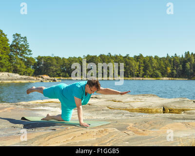 Real-life fitness training, mature woman training outdoor - horizon format image Stock Photo