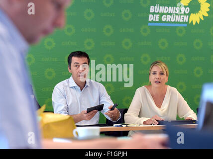 Berlin, Germany. 2nd Sep, 2015. Cem Özdemir and Simone Peter, leaders of the party Buendnis90/Die Grünen (Alliance 90/The Greens), greet each other at the beginning of the final test of the Greens Federal Executive in Berlin, Germany, 2 September 2015. Photo: RAINER JENSEN/dpa/Alamy Live News Stock Photo