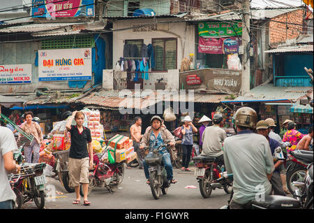 Cholon Vietnam street, a busy street scene in the downtown Cholon area of Ho Chi Minh City, Saigon, Vietnam. Stock Photo