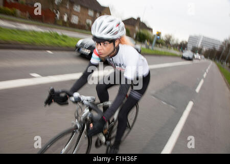 Cyclist on the Lewes Road heading into Brighton City Centre Stock Photo