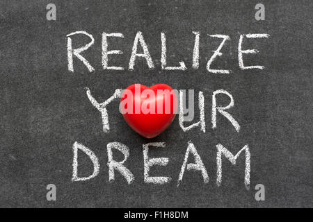 realize your dream phrase handwritten on blackboard with heart symbol instead of O Stock Photo