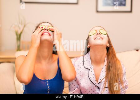 Two young women wearing face masks Stock Photo