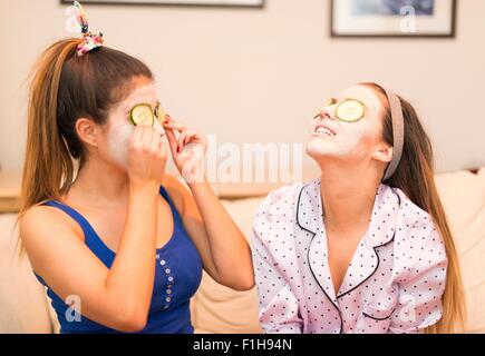 Two young women wearing face masks Stock Photo