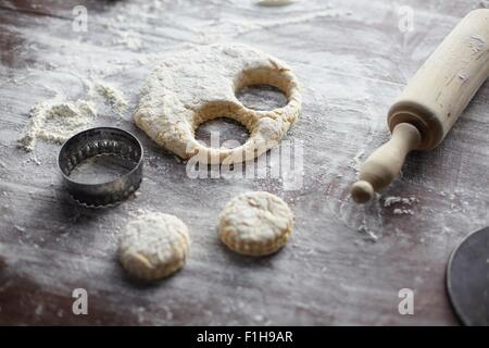 Baking preparation with scone dough and pastry cutters Stock Photo
