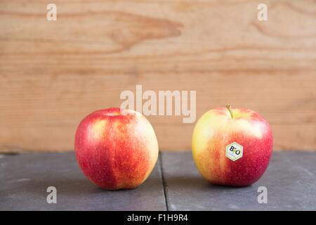 Still life of two apples - one with bio label Stock Photo