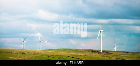 Panoramic view of wind turbines on moorland, UK Stock Photo