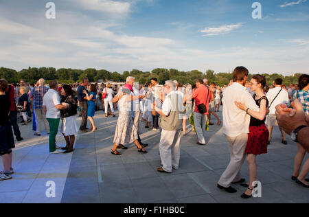 Visitors dancing at show gig with live music of Janek Mlynarski and Warszawskie Combo Taneczne, instruments and singing concert Stock Photo