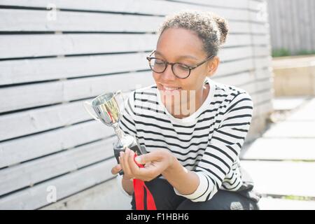 Mid adult woman holding trophy Stock Photo