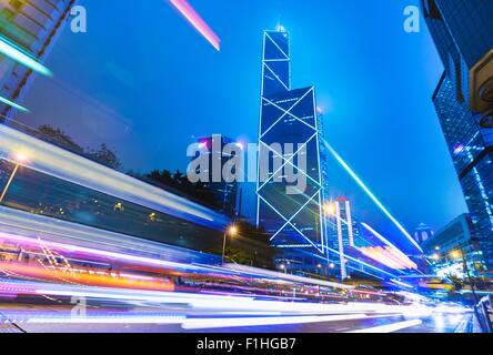 Central Hong Kong business district: skyline with Bank of China building and light trails at dusk, Hong Kong, China Stock Photo