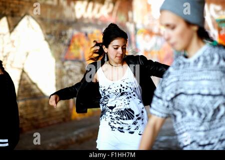 Young women dancing in the street