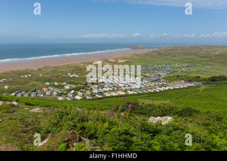 Elevated view of Rhossili beach and coast to Hillend The Gower Wales UK in summer with caravans and camping on the campsite Stock Photo