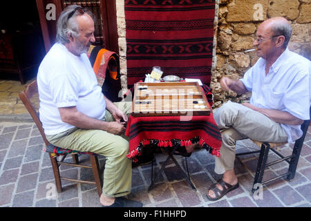 Men Playing Tavli, Chania Old Town, Crete, Greece Stock Photo
