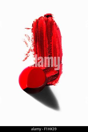 Abstract of piece of red lipstick with smudged line Stock Photo