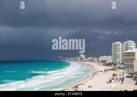 Stormy weather in Cancun, beautiful turquoise sea under dark blue clouds, view from above Stock Photo