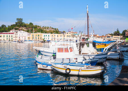 Moored small fishing boats in old Ischia port, Italy Stock Photo