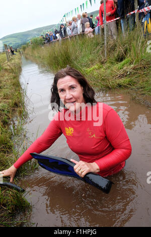 World Bog Snorkelling Championship female competitor shortly after completing her 120 yard snorkel Llanwrtyd Wells, Powys, Wales Stock Photo
