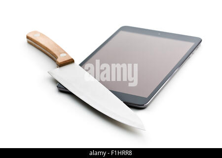 computer tablet and knife on white background Stock Photo