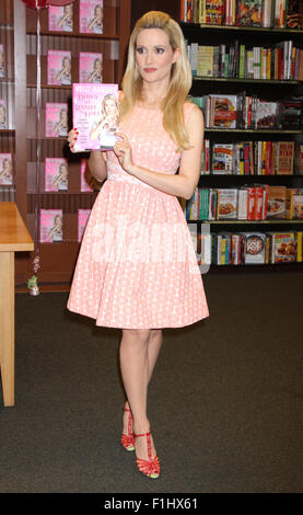 Reality star and former Playboy Playmate Holly Madison signs copies of