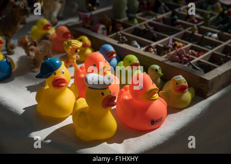 Rubber ducks and other objects of interest for sale at a Saturday market along The Dijver beside the canal, Bruges. Stock Photo