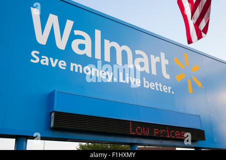 A logo sign outside of the Walmart headquarters, known as the Home Office in Bentonville, Arkansas on August 18, 2015. Stock Photo