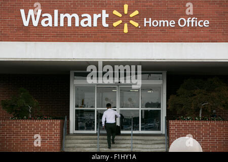A logo sign outside of the Walmart headquarters, known as the Home Office in Bentonville, Arkansas on August 18, 2015. Stock Photo