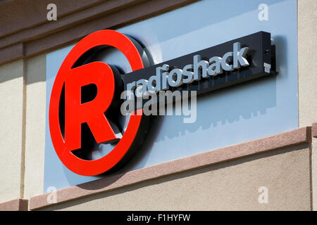 A logo sign outside of a joint Sprint and Radioshack store in Kansas City, Kansas on August 23, 2015. Stock Photo