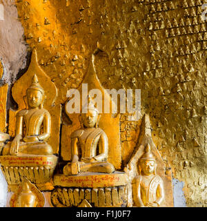 Some of the thousands of gilt images of the Buddha at Shwe Oo Min cave pagoda in Pindaya, Shan State, Myanmar Stock Photo