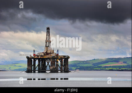 Oil rig / oil drilling platform waiting to be repaired in Cromarty Firth near Invergordon, Ross and Cromarty, Scotland, UK Stock Photo