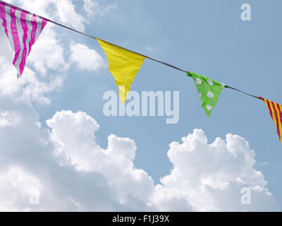 Celebratory bunting flags over cloudy sky. Stock Photo