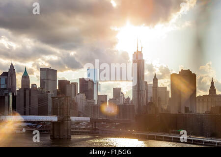 Bright Dramatic View of Downtown Manhattan with sun flare effect and warm toning Stock Photo