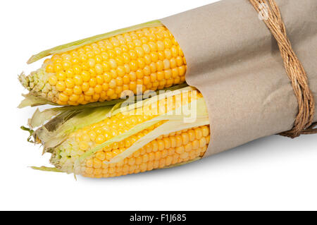Several corn cob in paper bag tied with rope isolated on white background Stock Photo