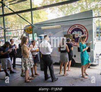 Ice cream lovers line up for a cool treat from the Coolhaus ice cream truck courtesy of the Canada Goose outdoor apparel company on Tuesday, September 1, 2015. The Canada Goose promotion was to promote the launch of their e-commerce site in the U.S. market. Their thousand dollar super-warm parkas were extremely popular and ubiquitous last winter and now you can order them online in the U.S.. (© Richard B. Levine) Stock Photo