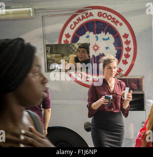 Ice cream lovers line up for a cool treat from the Coolhaus ice cream truck courtesy of the Canada Goose outdoor apparel company on Tuesday, September 1, 2015. The Canada Goose promotion was to promote the launch of their e-commerce site in the U.S. market. Their thousand dollar super-warm parkas were extremely popular and ubiquitous last winter and now you can order them online in the U.S.. (© Richard B. Levine) Stock Photo