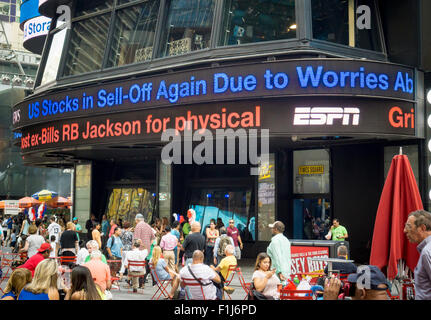A news ticker in Times Square in New York on Tuesday, September 1, 2015 reports that the Dow Jones dropped 470 points, its third biggest drop of the year. The rout was started by weak Chinese economic data.  (© Richard B. Levine) Stock Photo