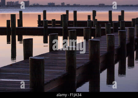 Americana Village, Selbyville Delaware, pier with a view of hotels rising from pre-dawn gloom of surf side Ocean City, Maryland. Stock Photo